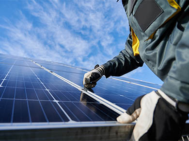 Man installing solar panel on a roof in Scotland